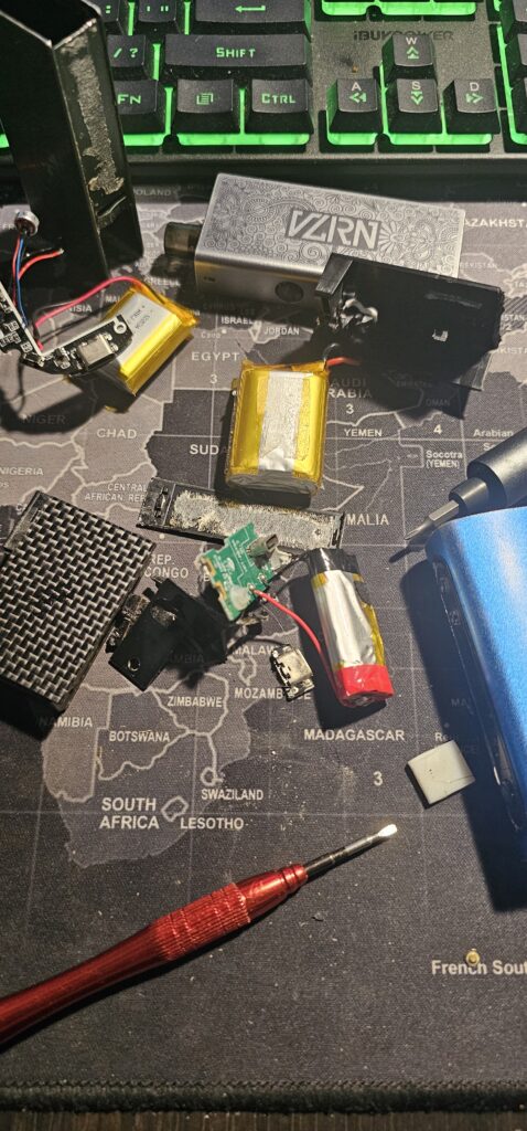 Best Stud Finder For Old Homes A pile of dismantled vape devices and recovered batteries.